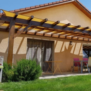 Pergola cover on yellow wooden structure